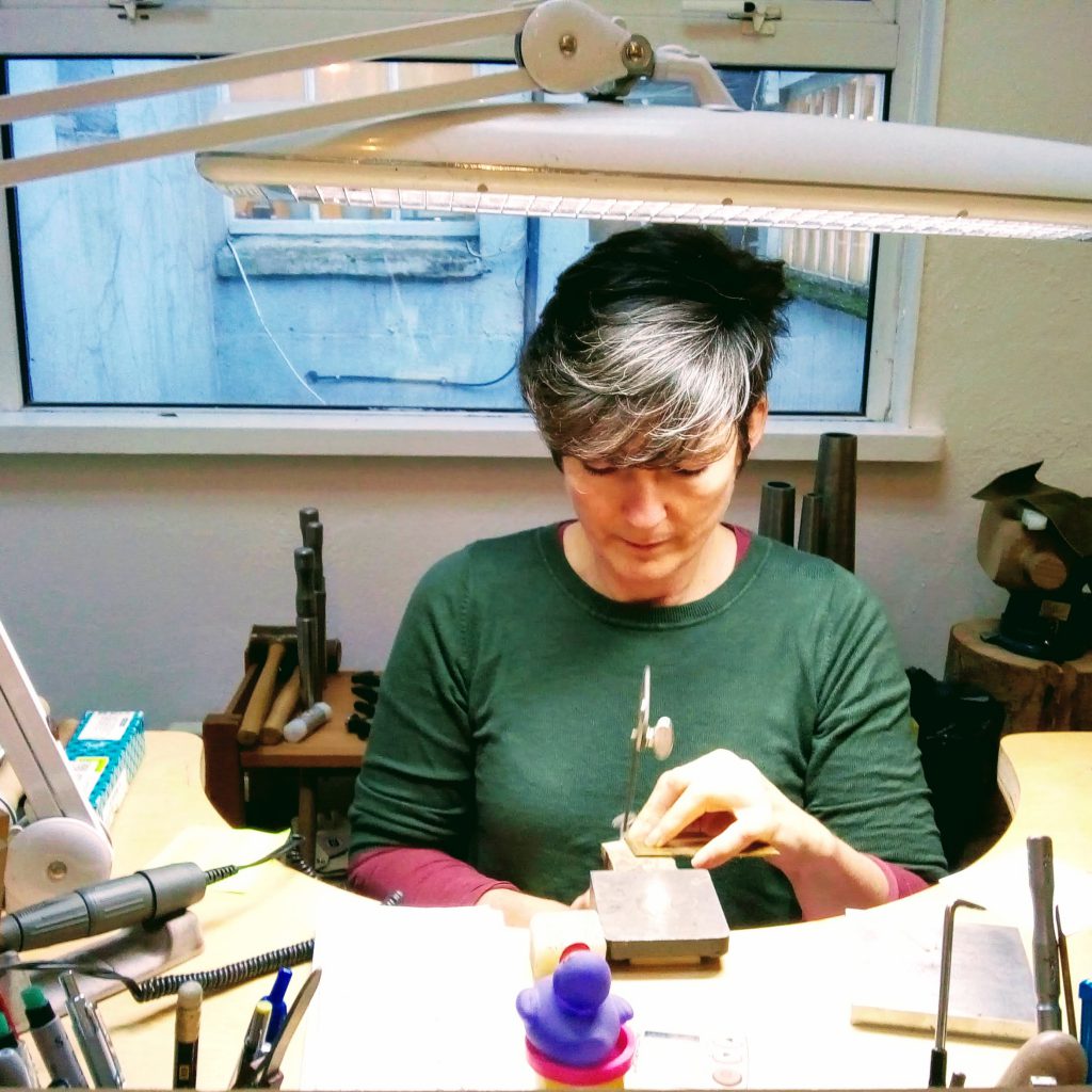Nicole van der Wolf at the bench in her studio