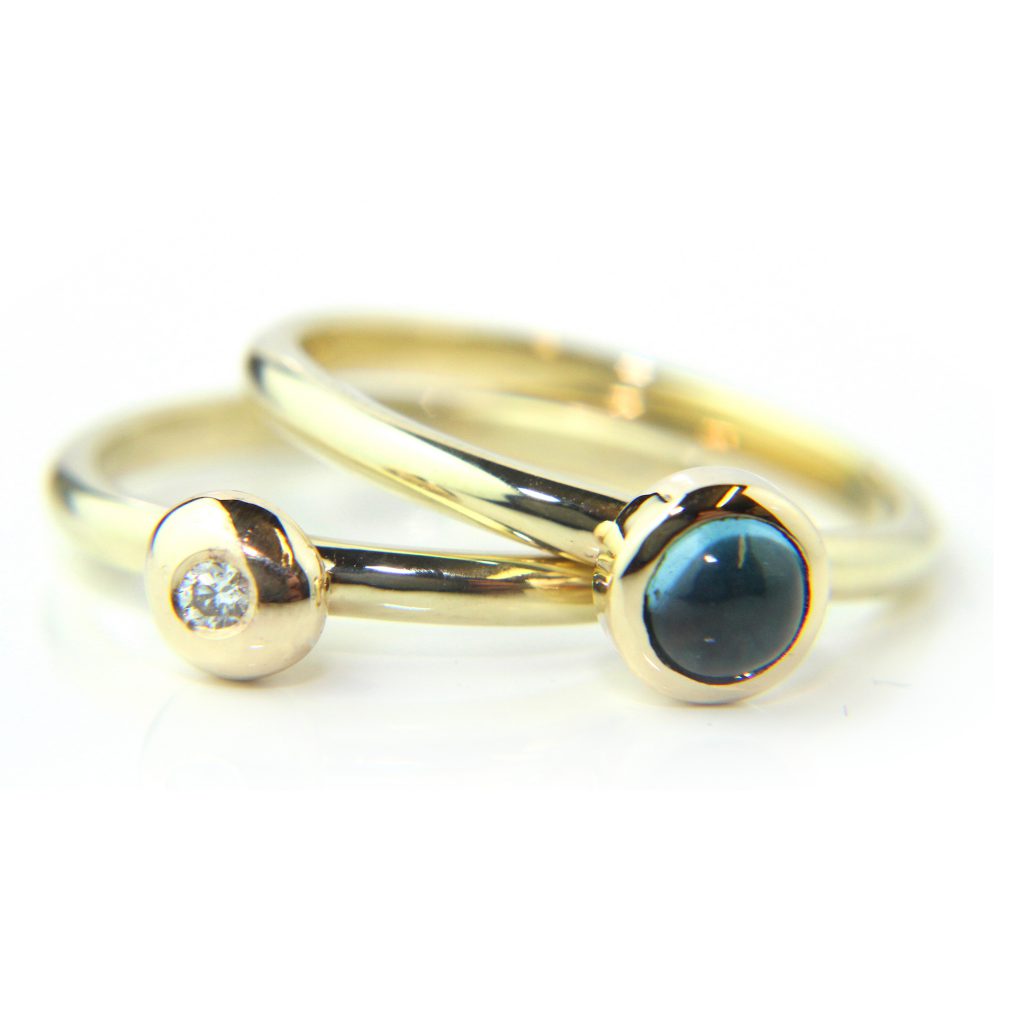 Double ring stack in 9k yellow gold with bezel set Topaz cabochon and diamond
